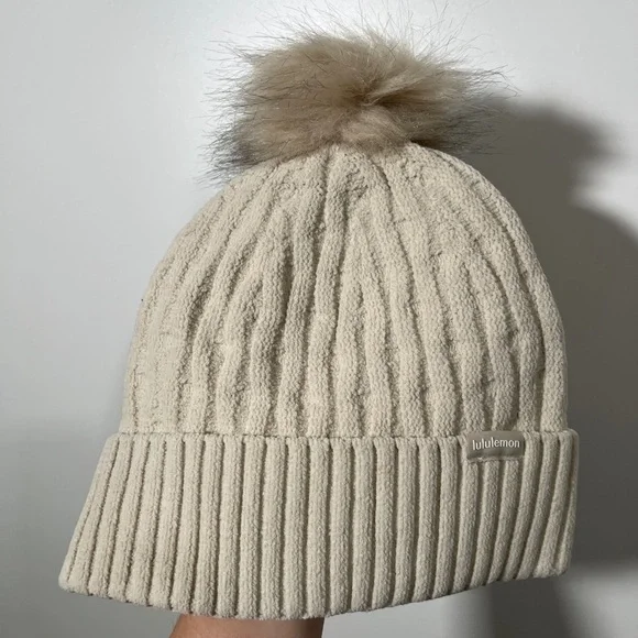Lululemon Cable Knit Pom Beanie in Cream One Size Cozy Cabin Core The 15 Best Lululemon Finds To Grab For The New Year main image 4